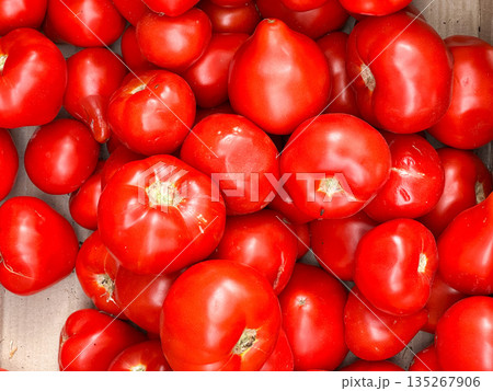 A pile of ripe red tomatoes filling the frame. A pile of ripe red tomatoes filling the frame. 135267906