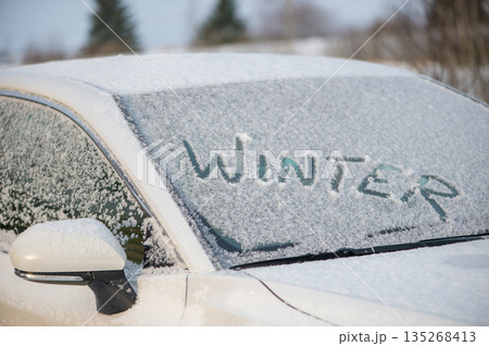 Winter Message Written On Snowy Car Window Winter Message Written On Snowy Car Window 135268413