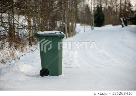 Green Waste Container On Snowy Winter Road Green Waste Container On Snowy Winter Road 135268416