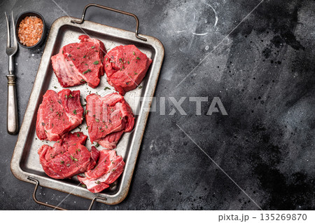 Raw beef boneless shank shin meat with herbs and spices ready for cooking. isolated on white background. top view 135269870