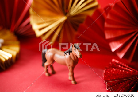 A festive Chinese New Year background with red paper fans. 135270610