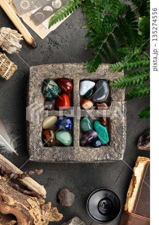 Colorful Healing Crystals in Stone Tray with Spiritual Elements Colorful Healing Crystals in Stone Tray with Spiritual Elements 135274556