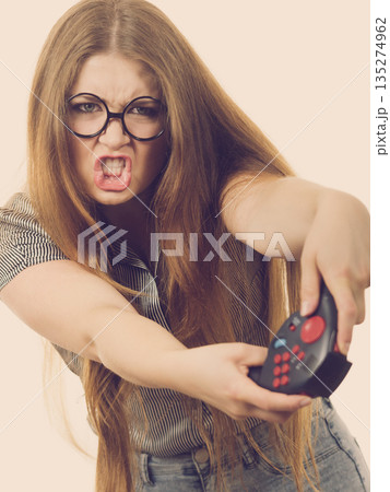Gamer woman holding gaming pad 135274962