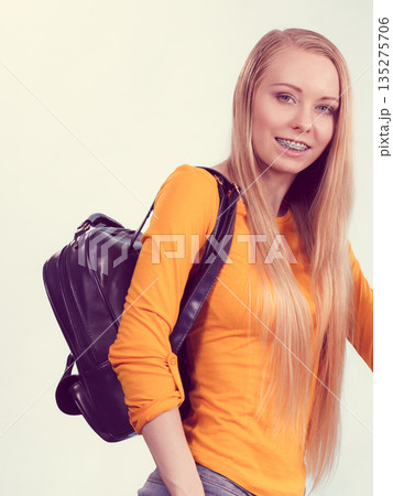 Young woman going to school Young woman going to school 135275706