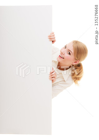 Businesswoman hiding behind blank copy space banner 135276668