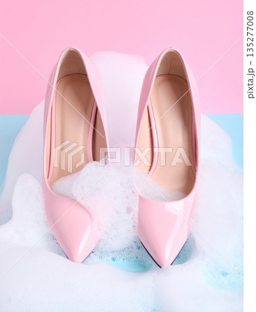 A pair of elegant pink ballet shoes and stylish high heels showcase a fusion of beauty and fashion in this closeup of sophisticated feminine footwear and accessory design A pair of elegant pink ballet shoes and stylish high heels showcase a fusion of beauty and fashion in this closeup of sophisticated feminine footwear and accessory design 135277008