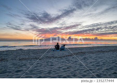 sunrise romantic couple on Corsican coast near Bastia Etang de Biguglia Camping San Daminao Beachside Corse sunrise romantic couple on Corsican coast near Bastia Etang de Biguglia Camping San Daminao Beachside Corse 135277444