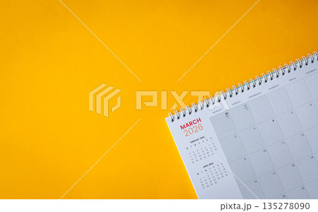 March 2026 calendar on top of yellow surface. 135278090