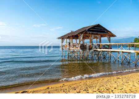Wooden pier on the beach of Lake Poso, Tentena, Sulawesi Wooden pier on the beach of Lake Poso, Tentena, Sulawesi 135278719