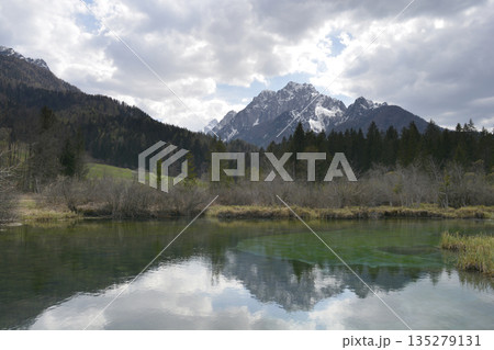 Alpine lake reflection of Ponce mountainsAlpine lake reflection of Ponce mountains Alpine lake reflection of Ponce mountainsAlpine lake reflection of Ponce mountains 135279131