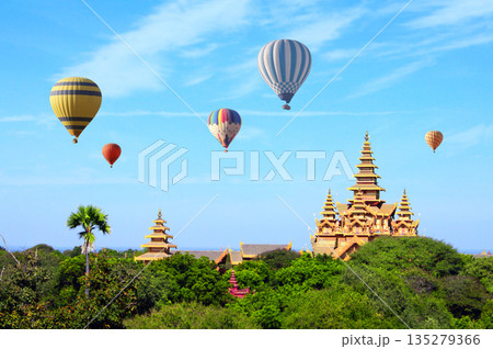 Balloon flight, famous tourist attraction of Bagan, Myanmar. Air balloons and temples in the Archaeological Zone, Bagan, Burma. Topic of vacation, travel, trip abroad on vacation, cruises and tours Balloon flight, famous tourist attraction of Bagan, Myanmar. Air balloons and temples in the Archaeological Zone, Bagan, Burma. Topic of vacation, travel, trip abroad on vacation, cruises and tours 135279366
