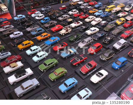 Flea antique market in Europe, Italy. Old vintage items. Toys, car, transport on tables in town. Retro objects for background design. Flea antique market in Europe, Italy. Old vintage items. Toys, car, transport on tables in town. Retro objects for background design. 135280190