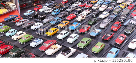 Flea antique market in Europe, Italy. Old vintage items. Toys, car, transport on tables in town. Retro objects for background design. Flea antique market in Europe, Italy. Old vintage items. Toys, car, transport on tables in town. Retro objects for background design. 135280196