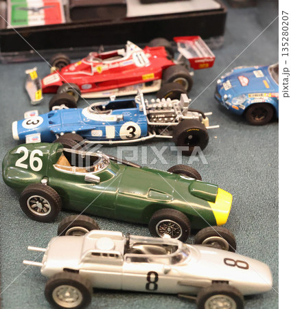 Flea antique market in Europe, Italy. Old vintage items. Toys, car, transport on tables in town. Retro objects for background design. Flea antique market in Europe, Italy. Old vintage items. Toys, car, transport on tables in town. Retro objects for background design. 135280207