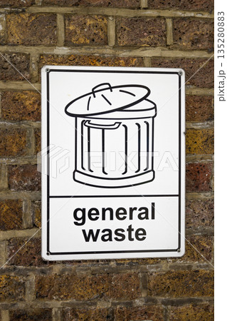 General Waste Sign With Trash Bin Icon on Brick Wall 135280883