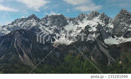 Green pasture and peaks of Apls mountain 135281099