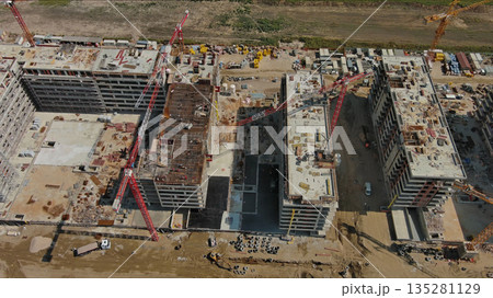 Industrial construction site with houses equipment and materials Industrial construction site with houses equipment and materials 135281129