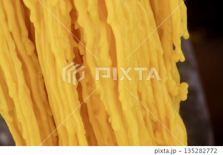 Yellow Candle Wax with Melted Pooled Texture Pattern Yellow Candle Wax with Melted Pooled Texture Pattern 135282772