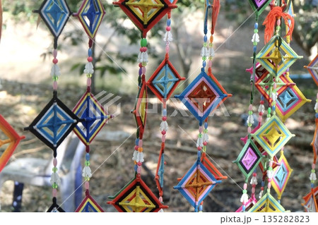 Colorful Silk Spiderweb Flag in Thai Buddhist Ritual Colorful Silk Spiderweb Flag in Thai Buddhist Ritual 135282823