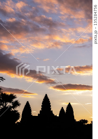 The silhouette of Angkor Wat at dawn in Siem Reap, Cambodia. This place is one of the UNESCO world heritage and symbol on the national flag of Cambodia. 135284756