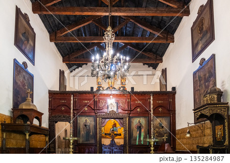 Holy Family Church located in the Coptic Cemetery in Cairo. The building features a simple facade with decorative elements and surrounding greenery. 135284987