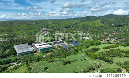 Building farm for chicken poultry houses and barn Philippines industrial aerial drone. Rural agriculture area, breeding chicken and fresh egg. Factory fabricated Cebu construction, additional poultry Building farm for chicken poultry houses and barn Philippines industrial aerial drone. Rural agriculture area, breeding chicken and fresh egg. Factory fabricated Cebu construction, additional poultry 135286379