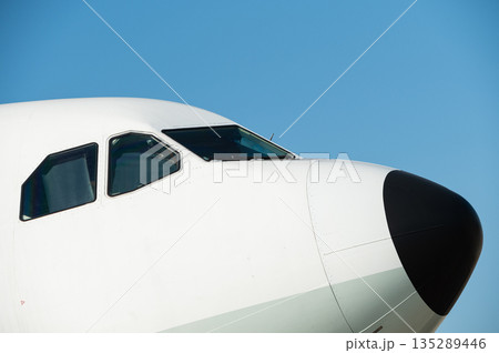 Close up of the cockpit windows and nose cone 135289446