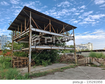 Abandoned unused rusty puzzle parking system in a residential area Abandoned unused rusty puzzle parking system in a residential area 135291950