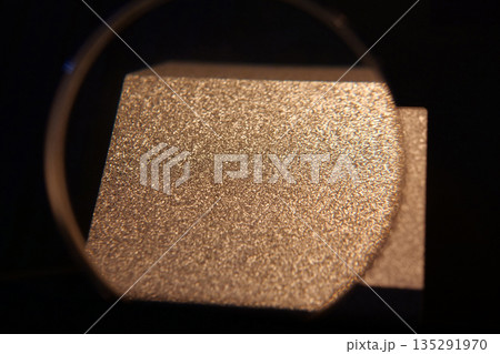 Sample of aluminum under magnifying glass with small grains,that froze very fast 135291970