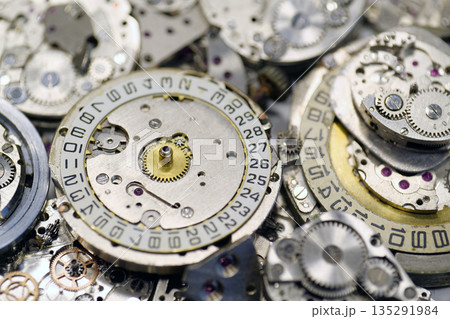 Old mechanical watches with gears and cogs. Watch or clock mechanisms 135291984