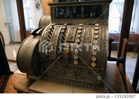 Antique cash register. Old mechanical cash register in pharmacy Antique cash register. Old mechanical cash register in pharmacy 135292007