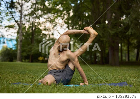 Therapeutic side stretch outdoor physiotherapy session 135292378