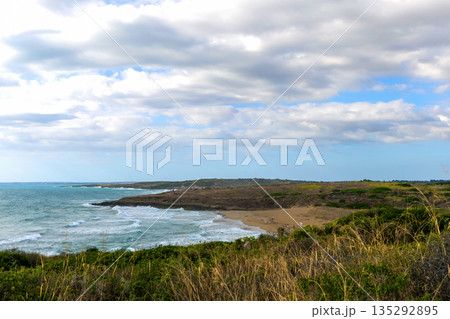 Sicilian coastline near Noto with green hills and sea. Sicilian coastline near Noto with green hills and sea. 135292895