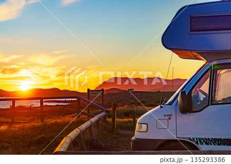Caravan on coast at sunset 135293386