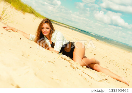 Long haired girl on beach, summertime 135293462