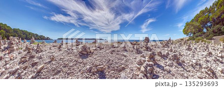Stone cairns on rocky beach along Adriatic Sea Stone cairns on rocky beach along Adriatic Sea 135293693