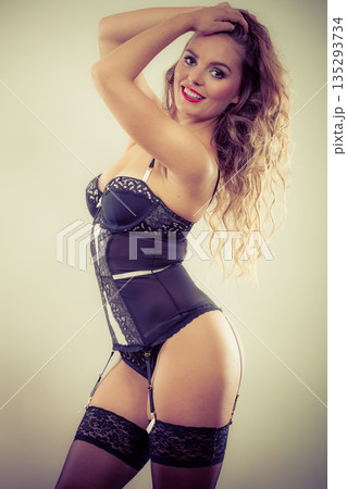 Sexy posing woman wearing lingerie Sexy posing woman wearing lingerie 135293734
