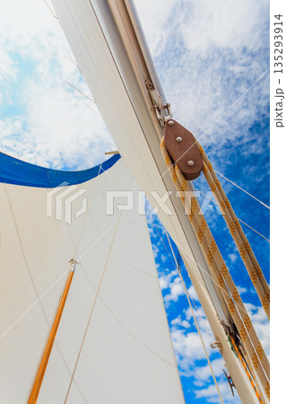 Detailed closeup of sail on sailboat Detailed closeup of sail on sailboat 135293914
