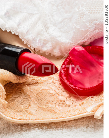 Condom and lipstick on lace lingerie Condom and lipstick on lace lingerie 135293930