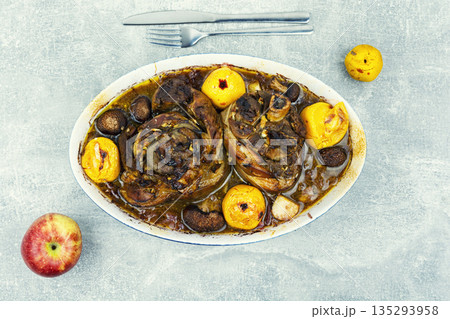 Roasted Pork Knuckles with Apples in Baking Dish Roasted Pork Knuckles with Apples in Baking Dish 135293958