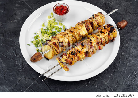 Potato and Bacon Skewers on Table 135293967