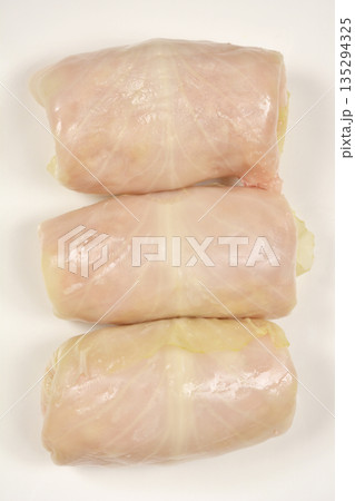Three uncooked sarma rolls on plate Three uncooked sarma rolls on plate 135294325