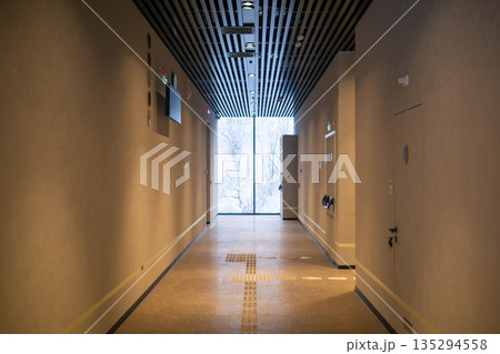 corridor in a modern office building, winter outside corridor in a modern office building, winter outside 135294558