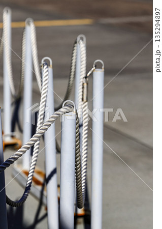 pole with restraining rope. Barrier, enclosed VIP area, protected entrance, private event, restrict area barricade pole. pole with restraining rope. Barrier, enclosed VIP area, protected entrance, private event, restrict area barricade pole. 135294897