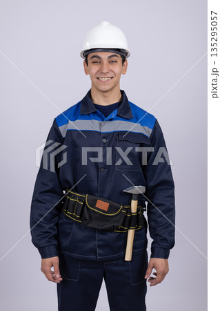 Professional worker with tool belt ready for repair Professional worker with tool belt ready for repair 135295057