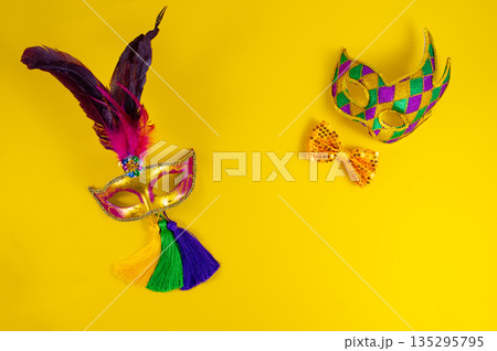 Mardi Gras background. Mardi Gras festive banner. Colorful beautiful masks with space for text. Mardi Gras background. Mardi Gras festive banner. Colorful beautiful masks with space for text. 135295795
