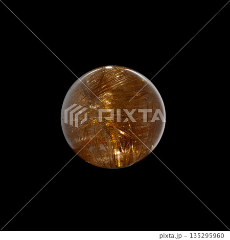 Ball of quartz with rutile on a black background 135295960