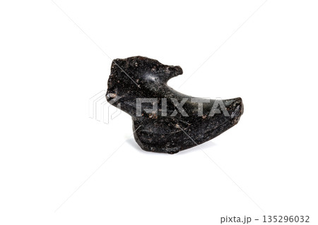 Macro stone mineral meteorite tektite on white background Macro stone mineral meteorite tektite on white background 135296032