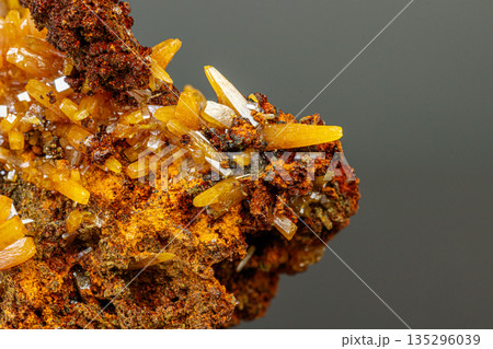 macro mineral Wulfenite stone on a black background macro mineral Wulfenite stone on a black background 135296039