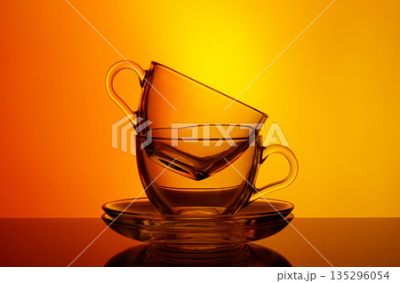 beautiful cups on an orange yellow background beautiful cups on an orange yellow background 135296054